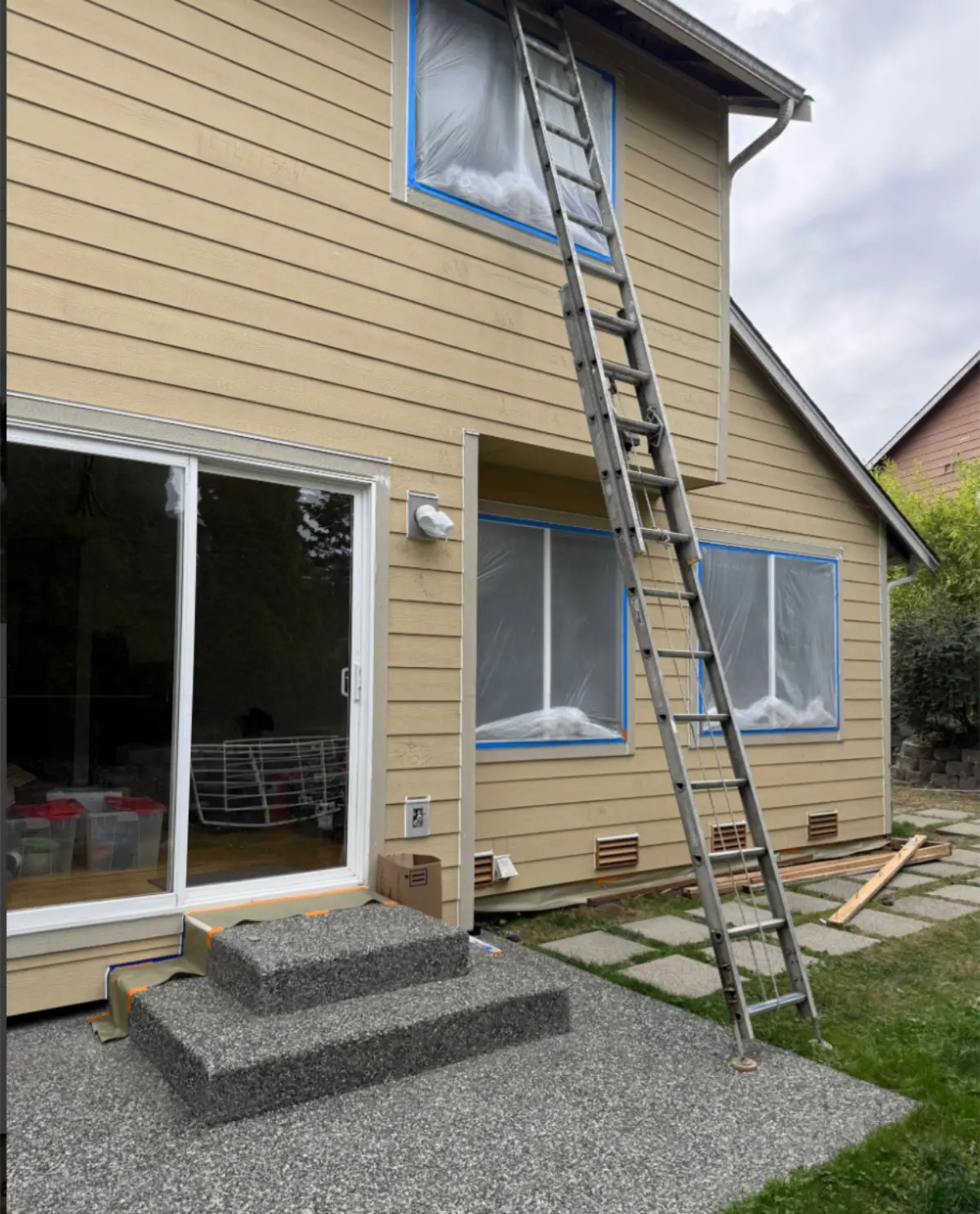 Completed siding on patio side with sliding door
