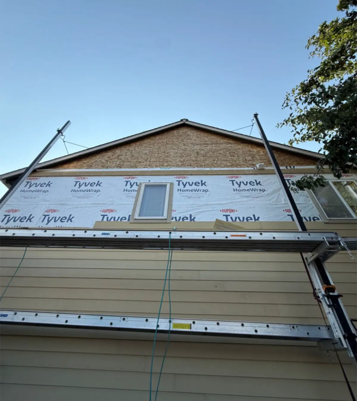 House wrap installed on upper wall section